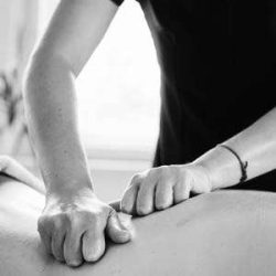 A massage therapist using the Swedish style